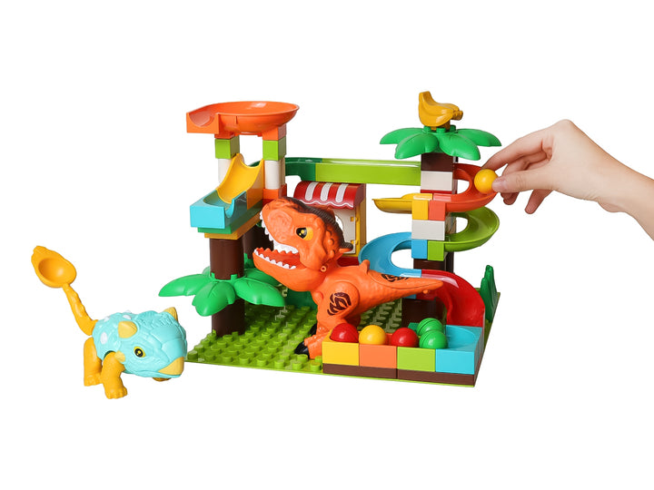 Set de bloques de construcción multicolores con toboganes y figuras de dinosaurios para niños.
