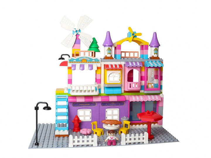 Set de bloques de construcción multicolor que forma una casa de juguete con molino y accesorios.