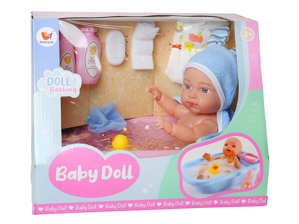 Set de juguete KELDER TOYS con muñeco bebé, tina rosa, gorro azul y accesorios de aseo.