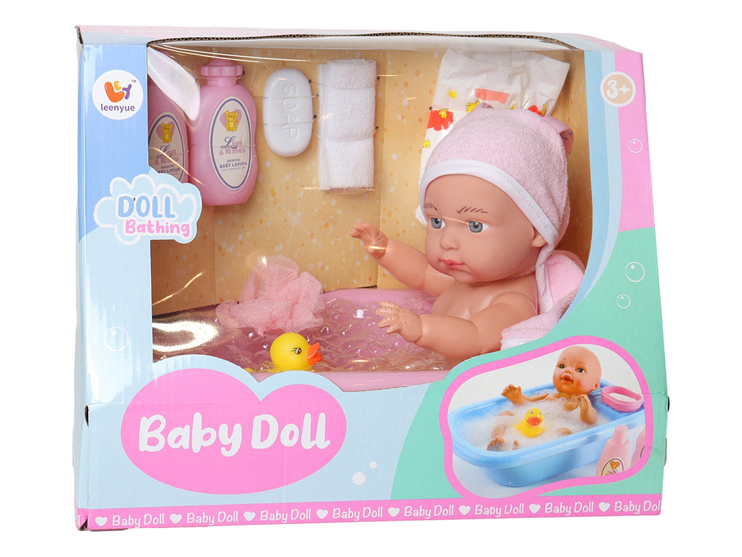Set de juguete de muñeco bebé en bañera rosa con accesorios como toalla, jabón y patito amarillo.