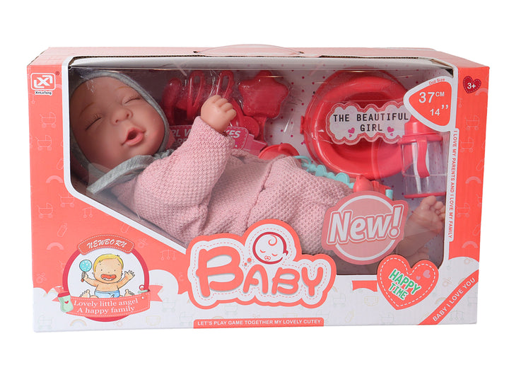 Muñeco bebé con ropa rosa y accesorios en caja, marca Kelder Toys.