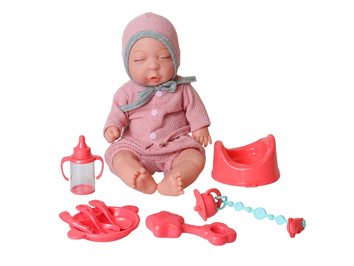 Muñeco bebé con ropa rosa y accesorios en caja, marca Kelder Toys.