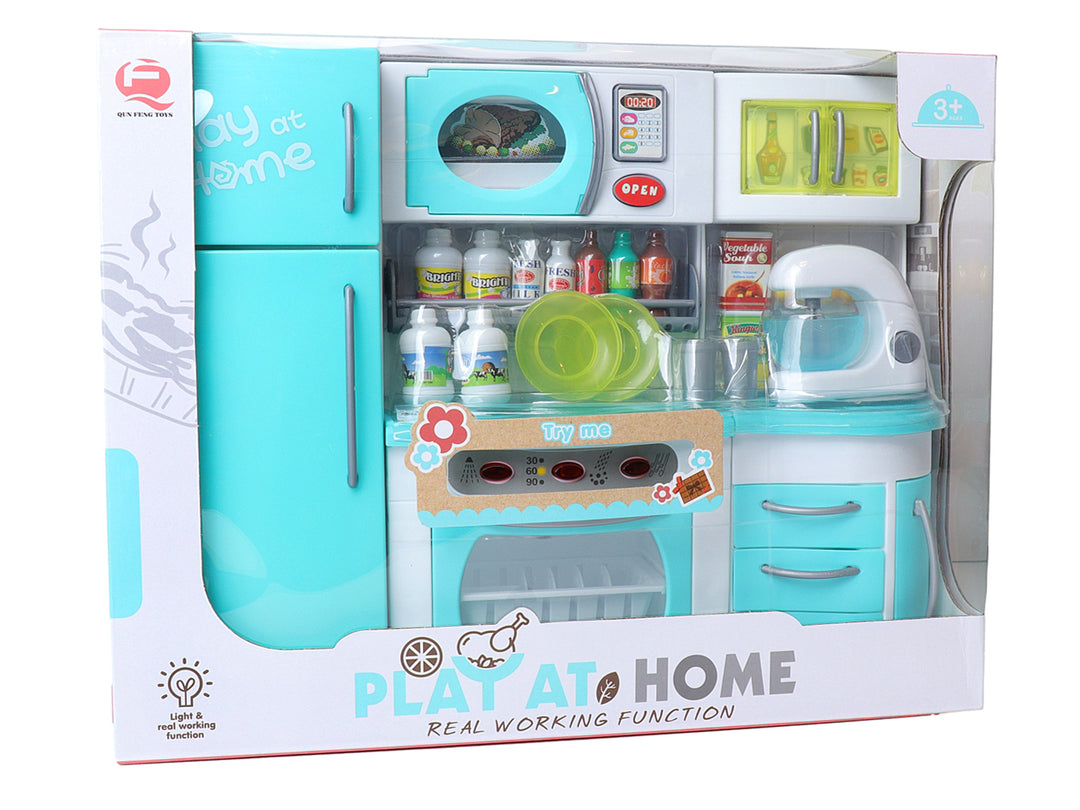 Set de cocina de juguete multicolor con refrigerador, horno y accesorios en su empaque original.