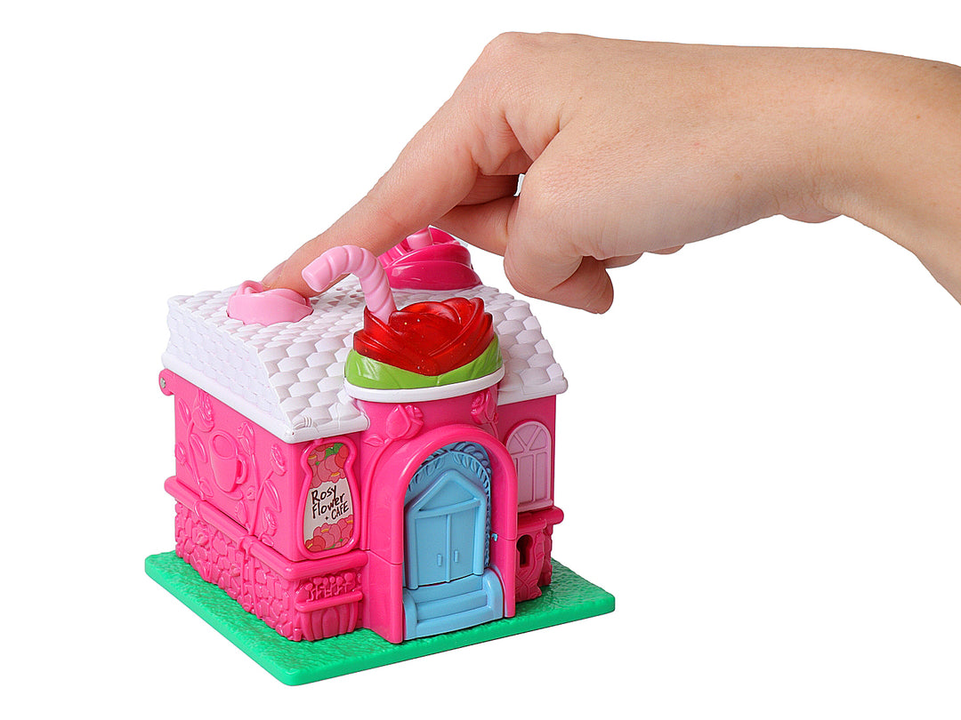 Juguete de casita de café multicolor con detalles en rosa y blanco, incluye accesorios y empaque original.
