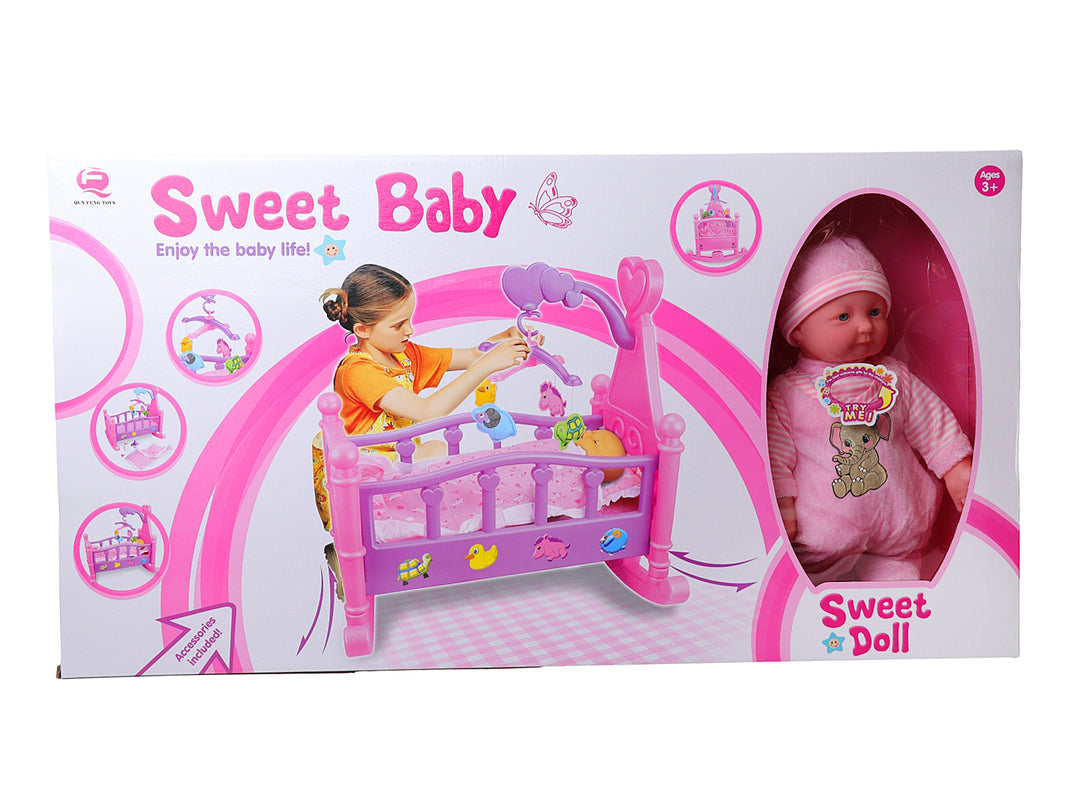 Set de juguete Sweet Baby que incluye una muñeca bebé y una cuna rosa con accesorios.