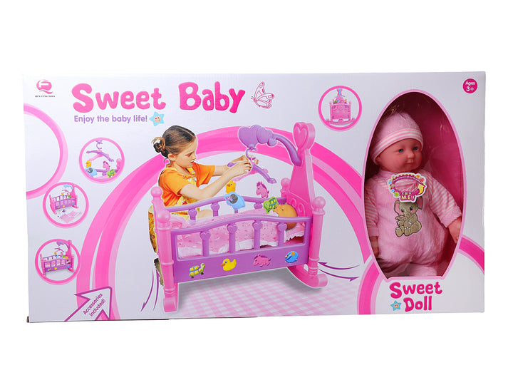 Set de juguete Sweet Baby que incluye una muñeca bebé y una cuna rosa con accesorios.