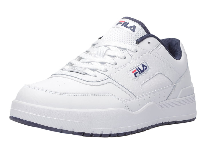 Tenis deportivos FILA de color blanco con detalles en azul marino, diseño clásico y suela blanca.