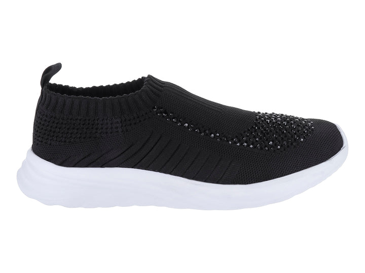 Tenis negros de textil con suela blanca y detalles brillantes en la punta.