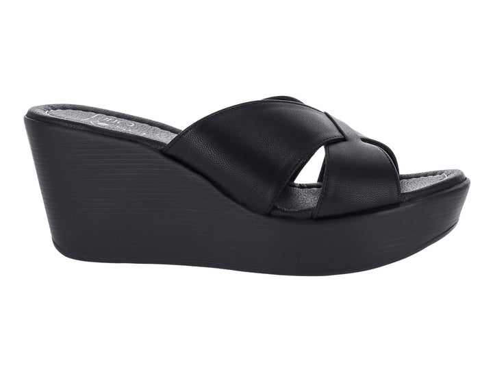 Sandalia de plataforma color negro con tiras cruzadas y suela de cuña.