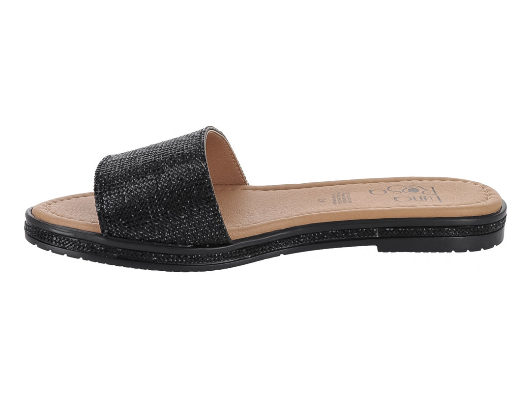 Sandalia plana color negro con tira ancha texturizada y plantilla beige.