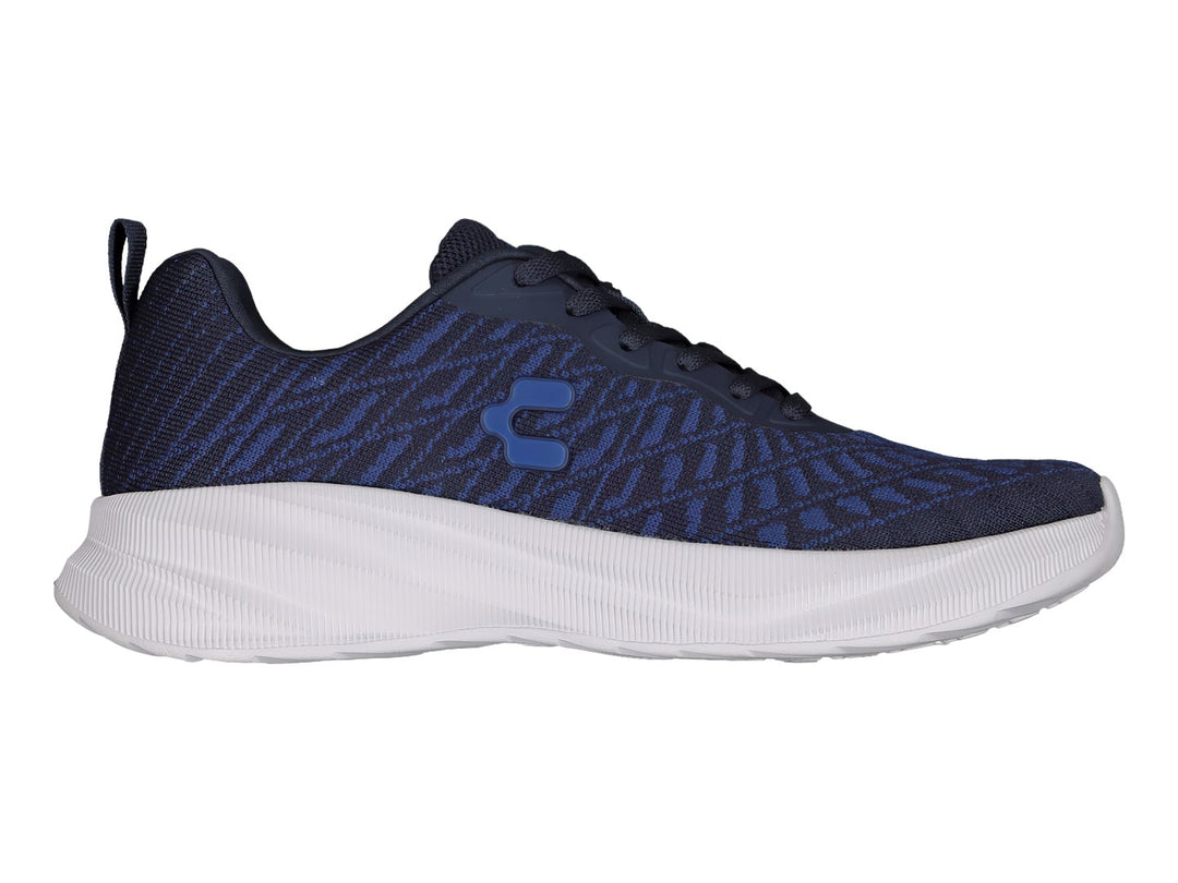 Tenis deportivos Charly color azul marino con suela blanca y tejido transpirable.