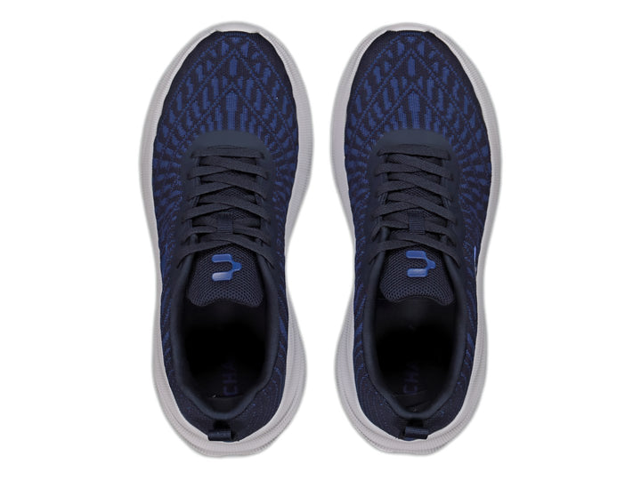 Tenis deportivos Charly color azul marino con suela blanca y tejido transpirable.
