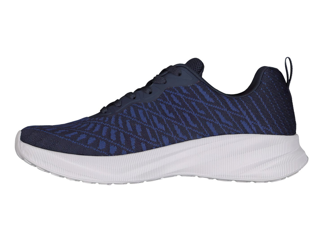 Tenis deportivos Charly color azul marino con suela blanca y tejido transpirable.
