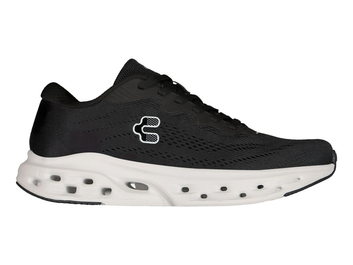 Tenis deportivos Charly color negro con suela blanca gruesa y transpirable.