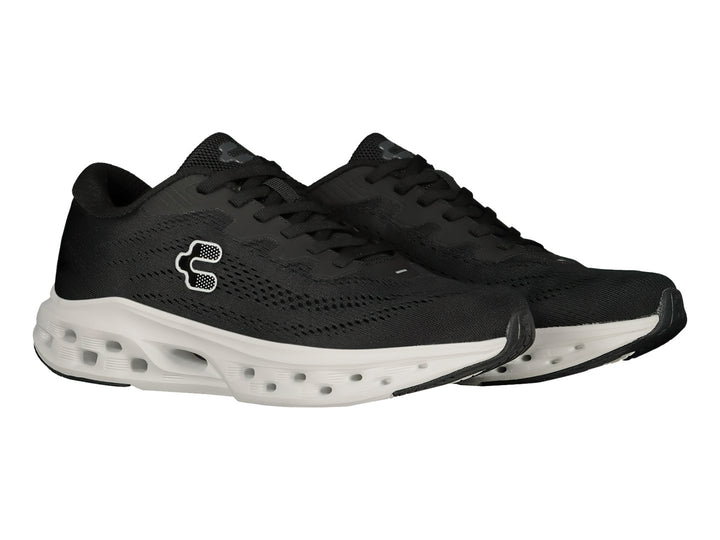 Tenis deportivos Charly color negro con suela blanca gruesa y transpirable.