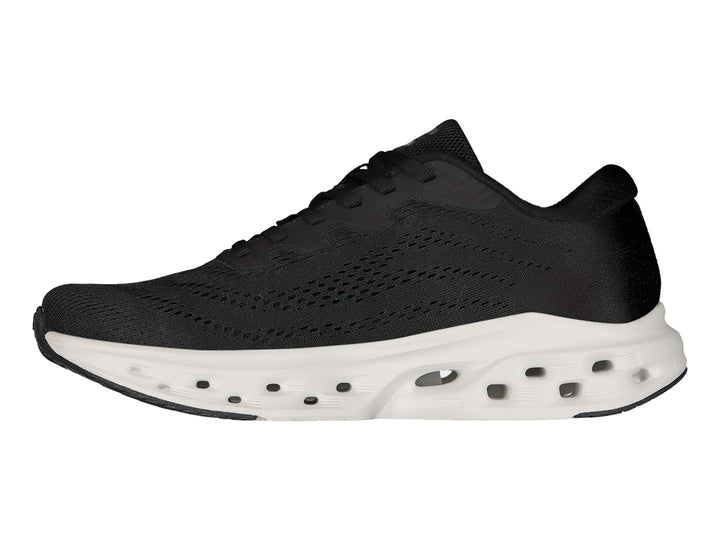 Tenis deportivos Charly color negro con suela blanca gruesa y transpirable.