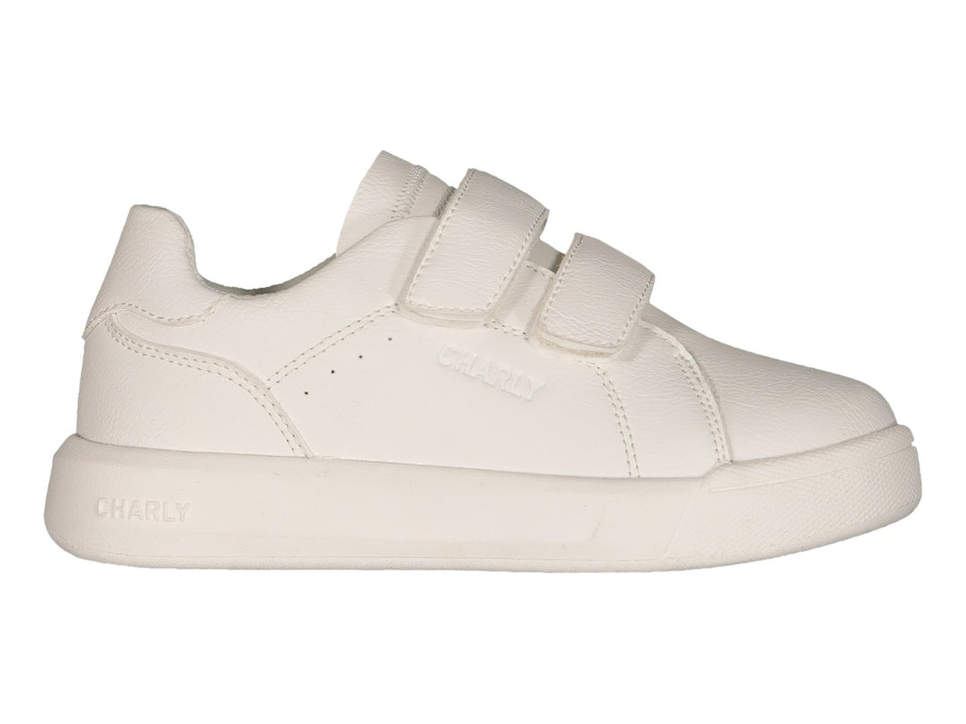 Tenis blancos Charly con cierre de velcro y suela blanca.