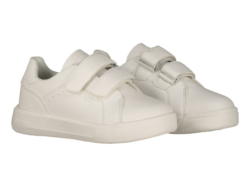 Tenis blancos Charly con cierre de velcro y suela blanca.