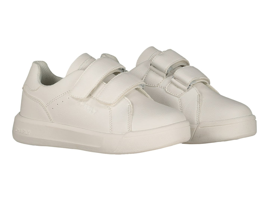 Tenis blancos Charly con cierre de velcro y suela blanca.