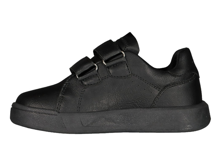 Zapato deportivo Charly color negro con cierre de dos correas de velcro y suela plana.