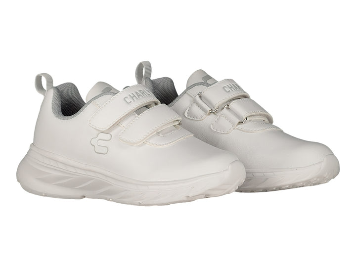 Tenis deportivos blancos de la marca Charly con cierre de velcro y suela gruesa.
