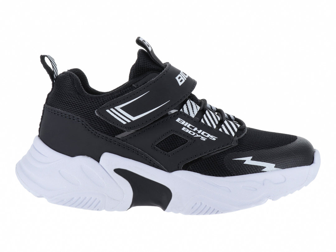 Tenis deportivos para niño marca BICHOS en colores negro y blanco con suela gruesa y cierre de velcro.