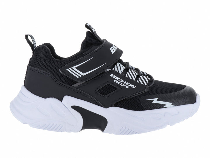 Tenis deportivos para niño marca BICHOS en colores negro y blanco con suela gruesa y cierre de velcro.