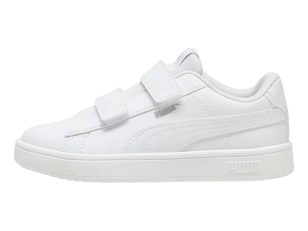 Tenis PUMA blancos para niño con cierre de velcro y suela blanca.