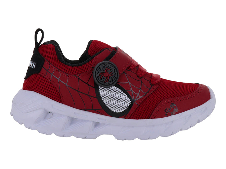 Tenis deportivos rojos para niño con detalles negros y suela blanca.