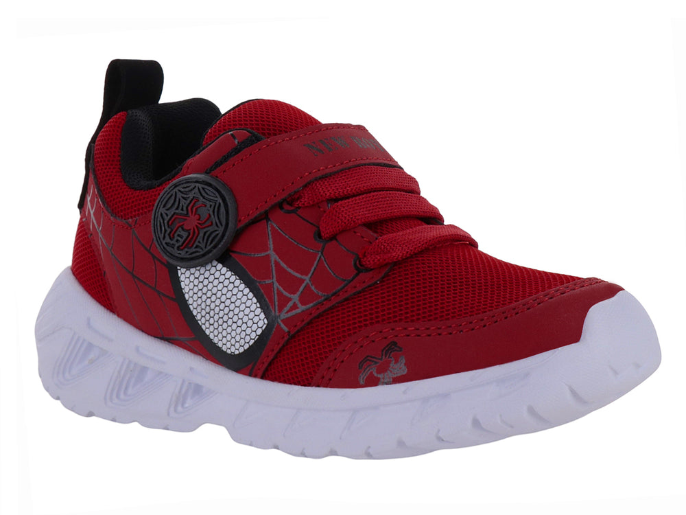Tenis deportivos rojos para niño con detalles negros y suela blanca.