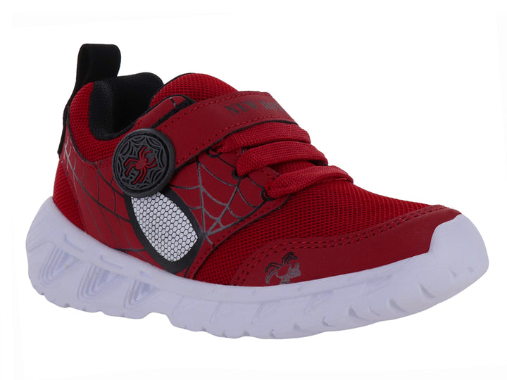 Tenis deportivos rojos para niño con detalles negros y suela blanca.
