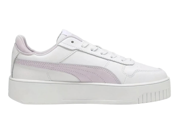 Tenis PUMA Carina Street JR color blanco con franja lila y suela de plataforma blanca.