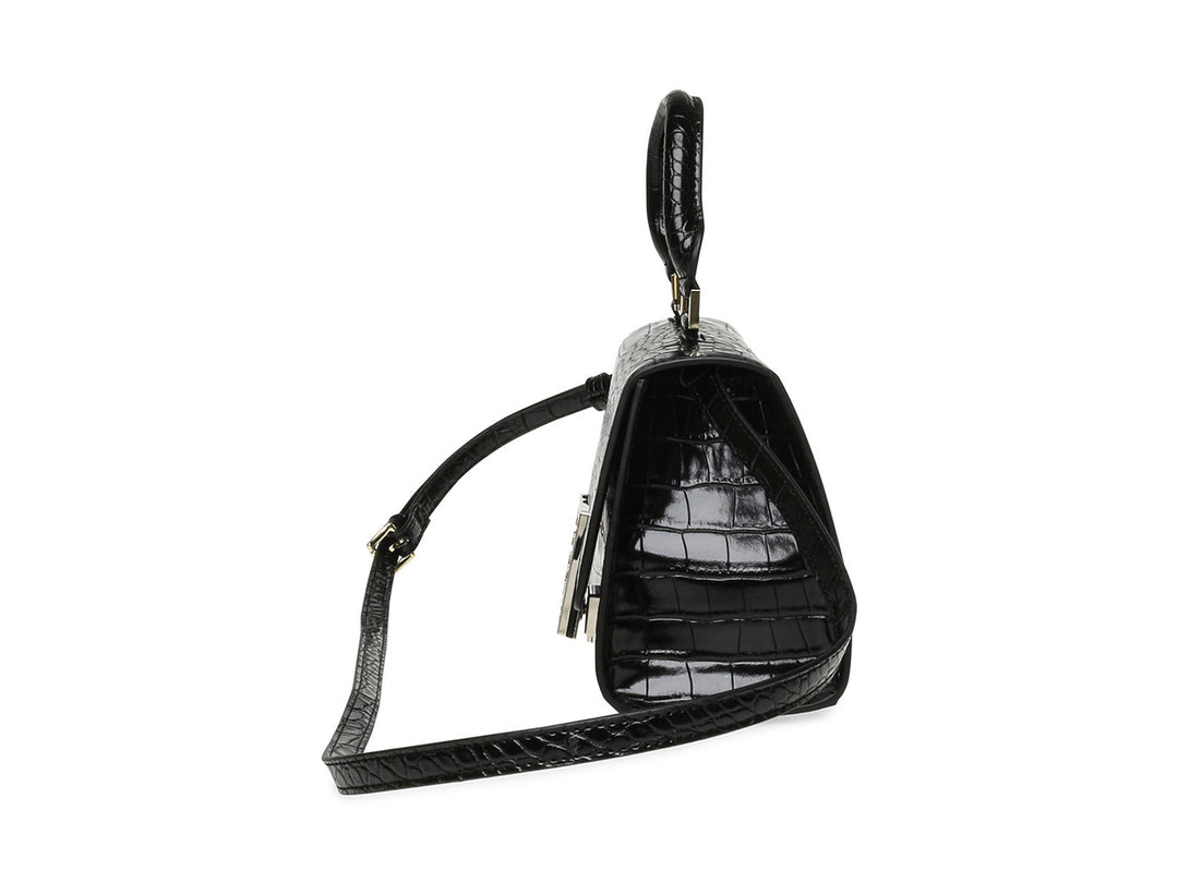 Bolso de hombro Steve Madden color negro con textura de cocodrilo y cierre dorado.