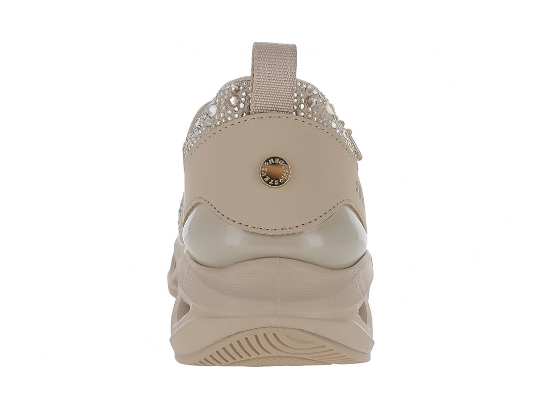 Tenis Steve Madden color rose gold con detalles de cristales brillantes y suela gruesa esculpida.