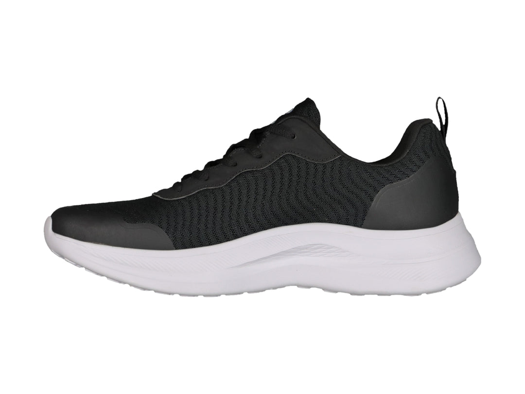 Tenis deportivos Charly color negro con suela blanca y tejido de malla.