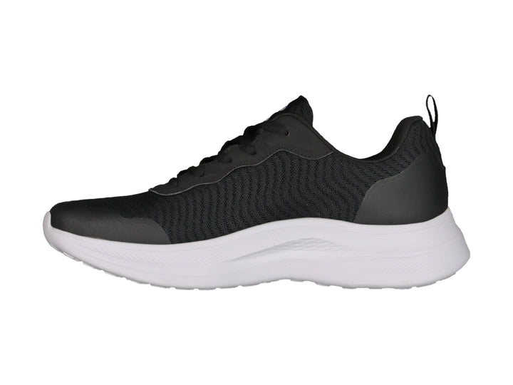 Tenis deportivos Charly color negro con suela blanca y tejido de malla.