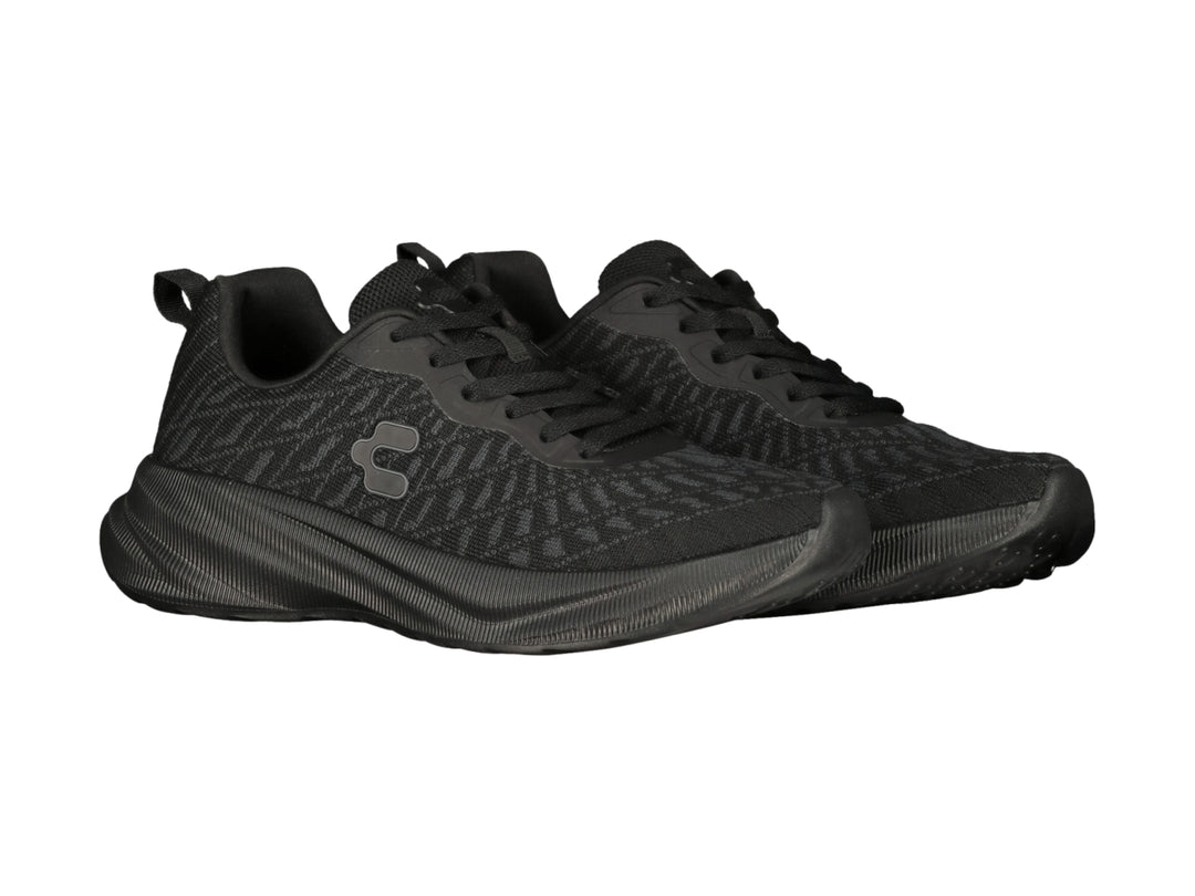 Tenis deportivos Charly color negro con tejido de malla y suela texturizada.