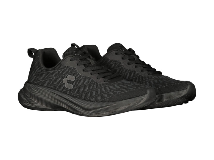 Tenis deportivos Charly color negro con tejido de malla y suela texturizada.