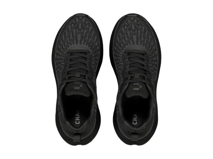 Tenis deportivos Charly color negro con tejido de malla y suela texturizada.