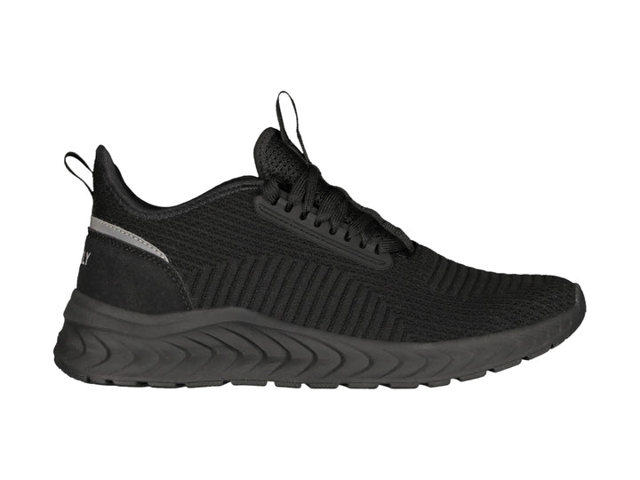 Tenis deportivos Charly color negro con suela gruesa y detalle gris en el talón.