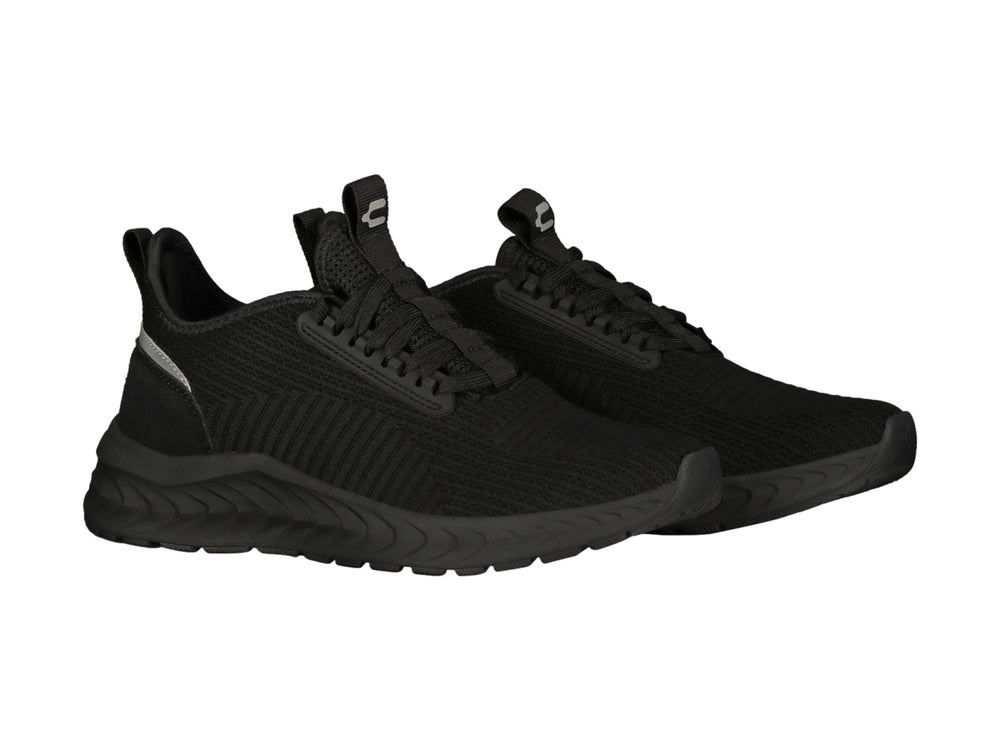 Tenis deportivos Charly color negro con suela gruesa y detalle gris en el talón.