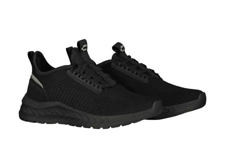 Tenis deportivos Charly color negro con suela gruesa y detalle gris en el talón.