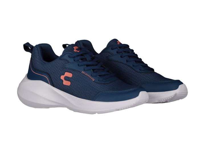 Tenis deportivos Charly color azul marino con suela blanca y detalles en coral.