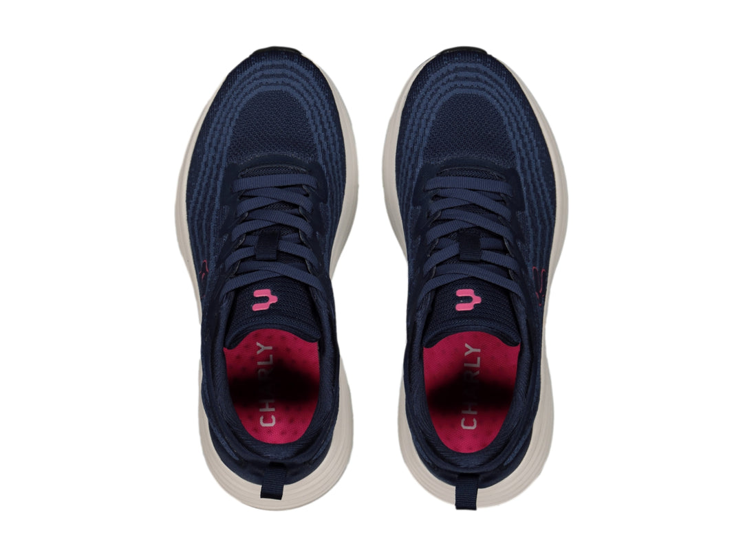 Tenis deportivos Charly color azul marino con suela blanca y detalle en rosa.