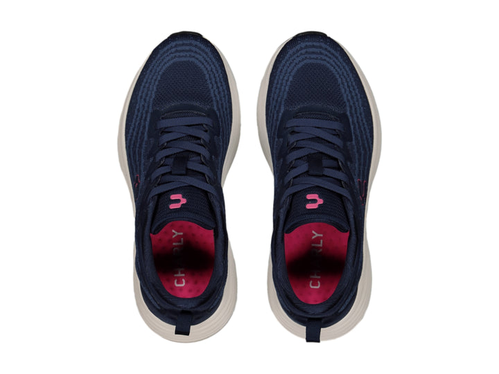 Tenis deportivos Charly color azul marino con suela blanca y detalle en rosa.
