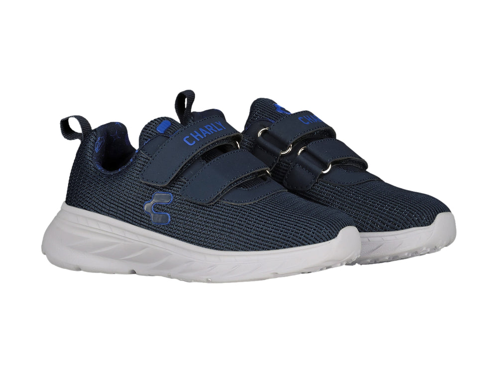 Tenis deportivos Charly en color azul marino con suela blanca y cierre de velcro para niño.