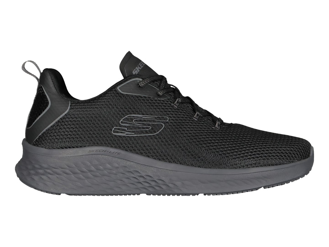Tenis deportivos Skechers color negro con detalles en gris, diseño de malla transpirable y suela acolchada.