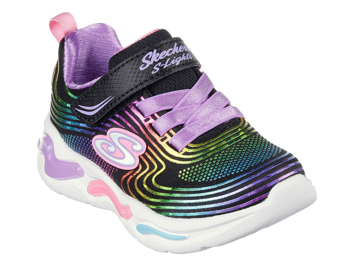 Tenis Skechers negros con patrones de colores arcoíris y suela blanca con relieves coloridos.
