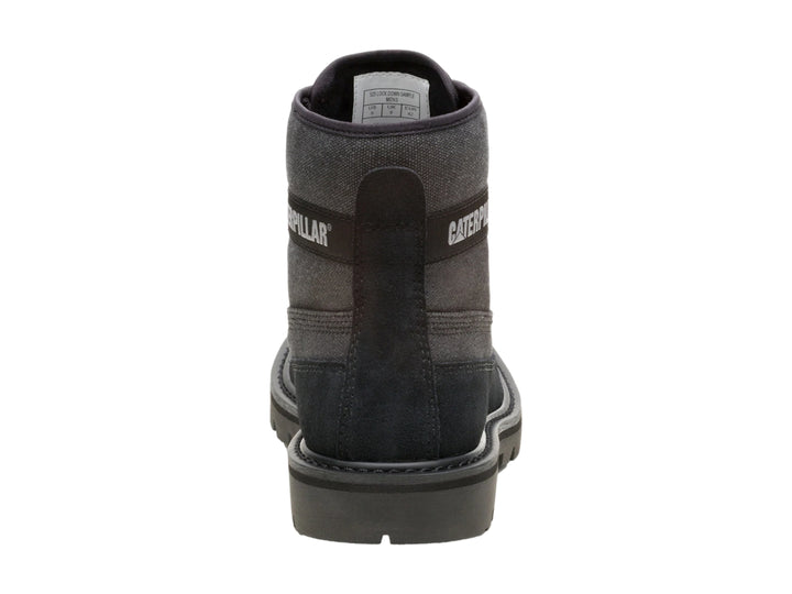 Bota Caterpillar color negro de material canvas y gamuza con suela robusta y cordones.