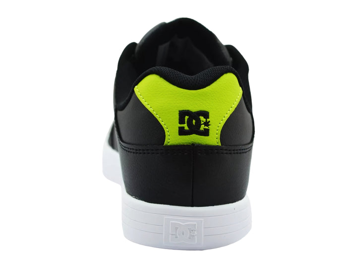 Tenis DC Shoes modelo Adys en color negro con detalles en verde neón y suela blanca.
